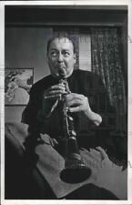 1954 Press Photo Woody Herman tunes his clarinet before performing at Riverside picture