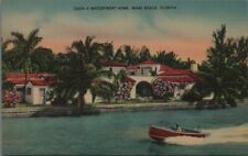 A Waterfront Home Miami Florida Beach Postcard Wooden Boat B36 picture