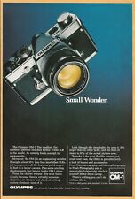 OLYMPUS OM-1 camera - Small Wonder - 1975 Vintage Nat Geo Print Ad picture