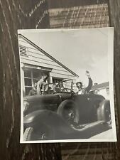 Black & White original photo Of A Man Waving in His 30's Plymouth Chrysler Car picture