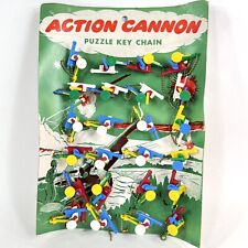 FANTASTIC VINTAGE ACTION CANNON KEYCHAIN PUZZLE STORE DISPLAY NEW UNUSED W/ CASE picture