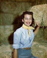 Gail Russell smiling portrait in blue shirt sits on bale of hay 24x36 Poster picture