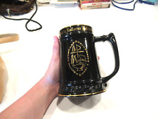 Pacific Lutheran University black mug with gold trim picture