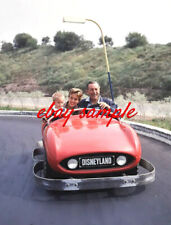 WALT DISNEY PHOTO -With daughter and grandson riding Autopia cars at Disneyland picture