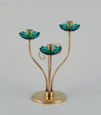 Gunnar Ander for Ystad Metall. Brass candlestick holder. Turquoise glass sleeves picture