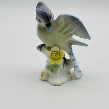 Vintage Gray Bird With Blue Accents Sitting On Stump picture
