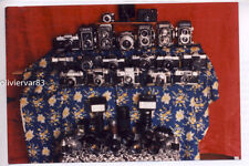 Vintage 1980s photo - large display of Rollei, Leica and other cameras picture