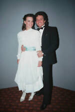 Sherilyn Wolter wearing a full-length white dress a pale blue sash- Old Photo 1 picture