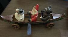 Vintage German Metal Toy 1950’s Santa, Frosty, And Bear In A Canoe Wheels N Oars picture