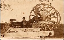 Man Posing on Big Wheel Michigan Logging RPPC Postcard picture