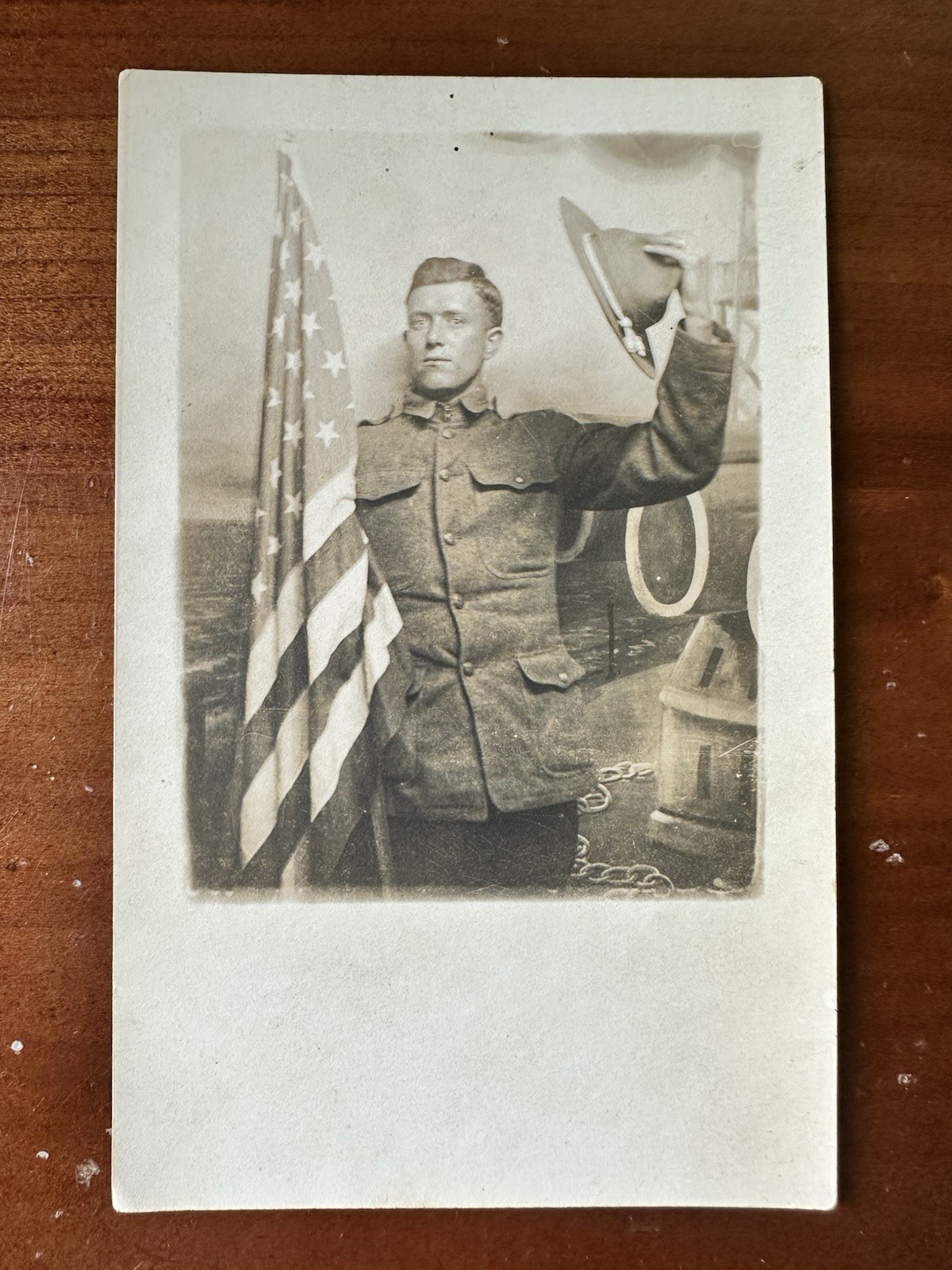 Great Shot, WWI soldier Waving Cap And Holding US flag postcard RPPC Great Shot, WWI soldier Waving Cap And Holding US flag postcard RPPC