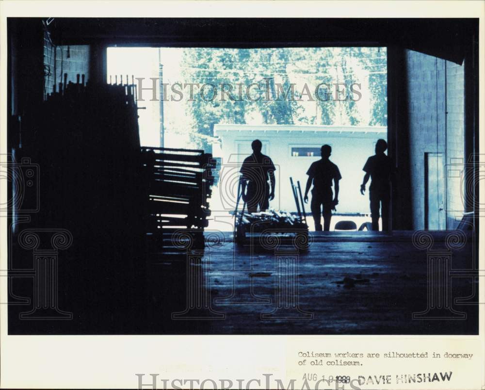 1988 Press Photo Coliseum workers silhouetted in Independence Arena - lra68011
