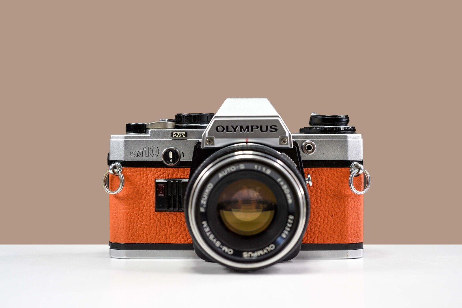 OLYMPUS OM10 35mm Film Camera w/ 50mm f/1.8 Zuiko Lens Orange Leather | Serviced