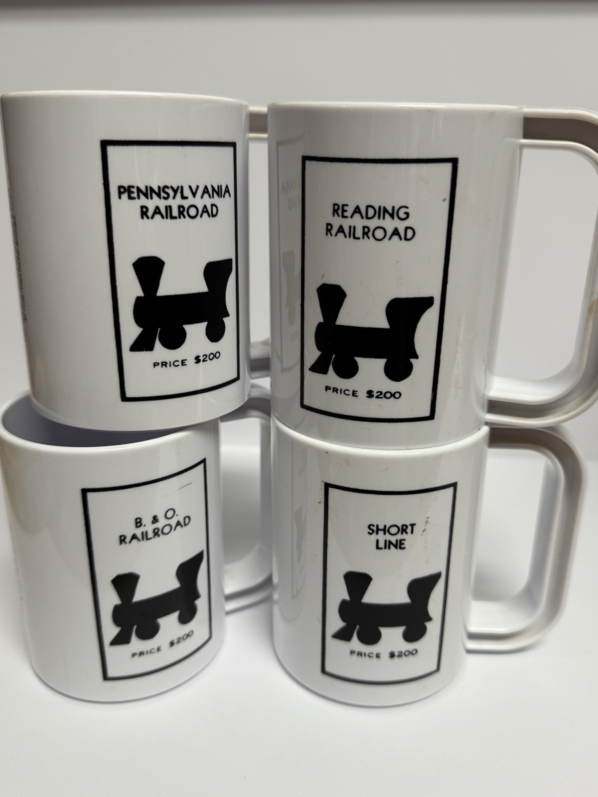 MONOPOLY RAILROAD COFFEE MUGS READING B&O PENNSYLVANIA VINTAGE RARE SET OF 4 MONOPOLY RAILROAD COFFEE MUGS READING B&O PENNSYLVANIA VINTAGE RARE SET OF 4