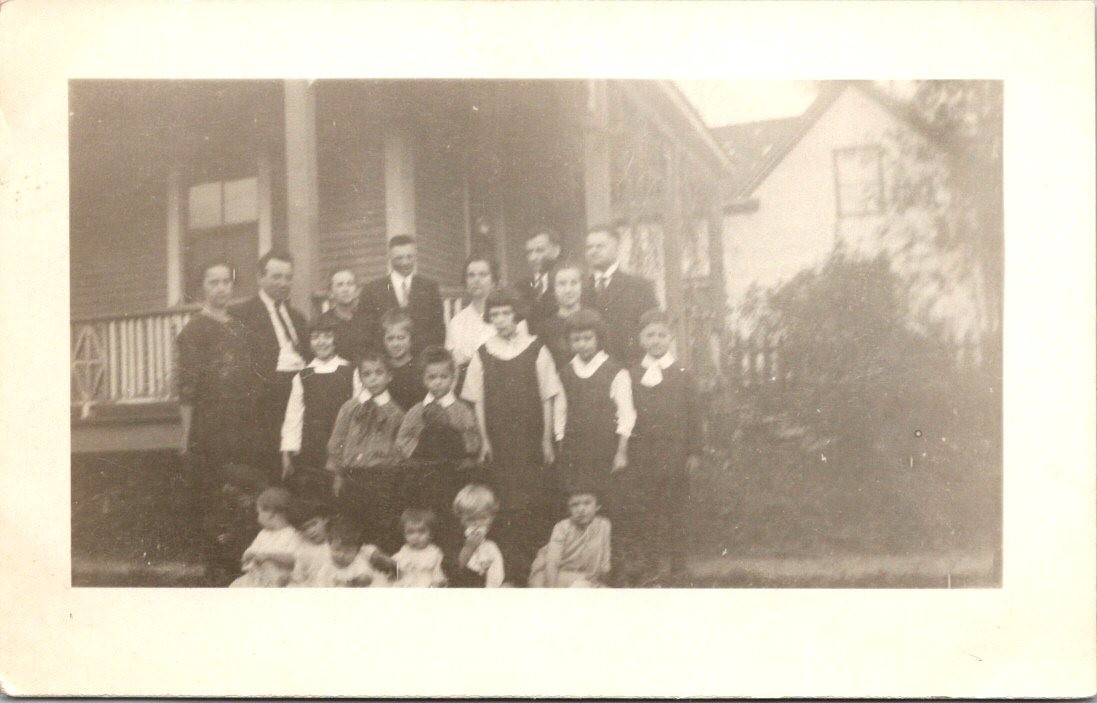 Group Family Photo In Front of Unidentified House c1930s RPPC Postcard Group Family Photo In Front of Unidentified House c1930s RPPC Postcard