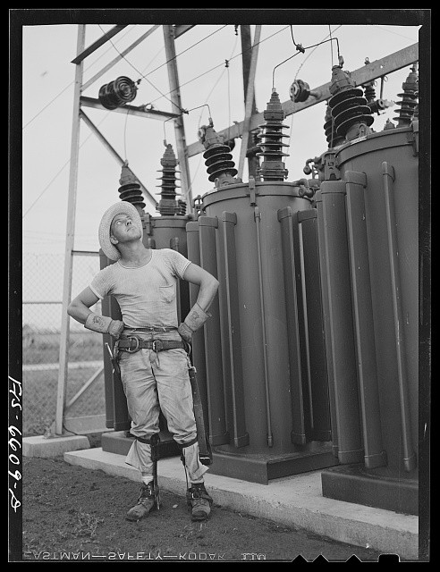 Photo:Hayti Missouri REA Lineman Examining Substation Transformers 1942
