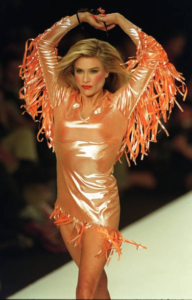 Samantha Fox models a shiny orange tassled dress for Red Or Dead t- Old Photo