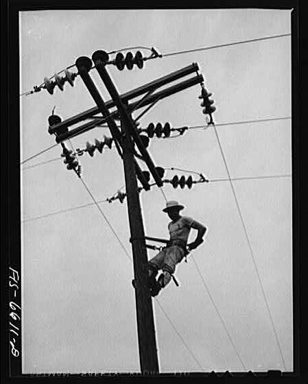 Photo:Hayti Missouri 1930s REA Cooperative Lineman on Utility Pole