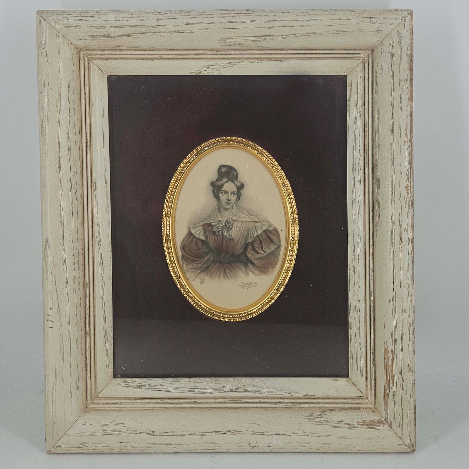 Vintage oval brass detail portrait of lady in deep well distressed white frame Vintage oval brass detail portrait of lady in deep well distressed white frame