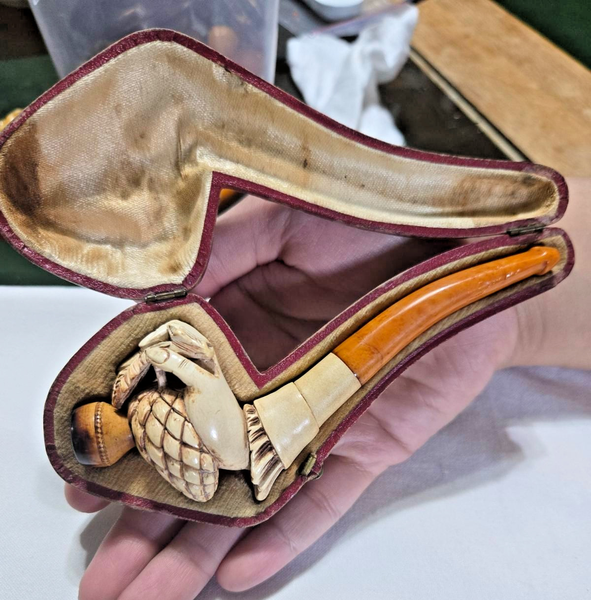 antique carved meerschaum pipe featuring a detailed hand holding a pinecone antique carved meerschaum pipe featuring a detailed hand holding a pinecone