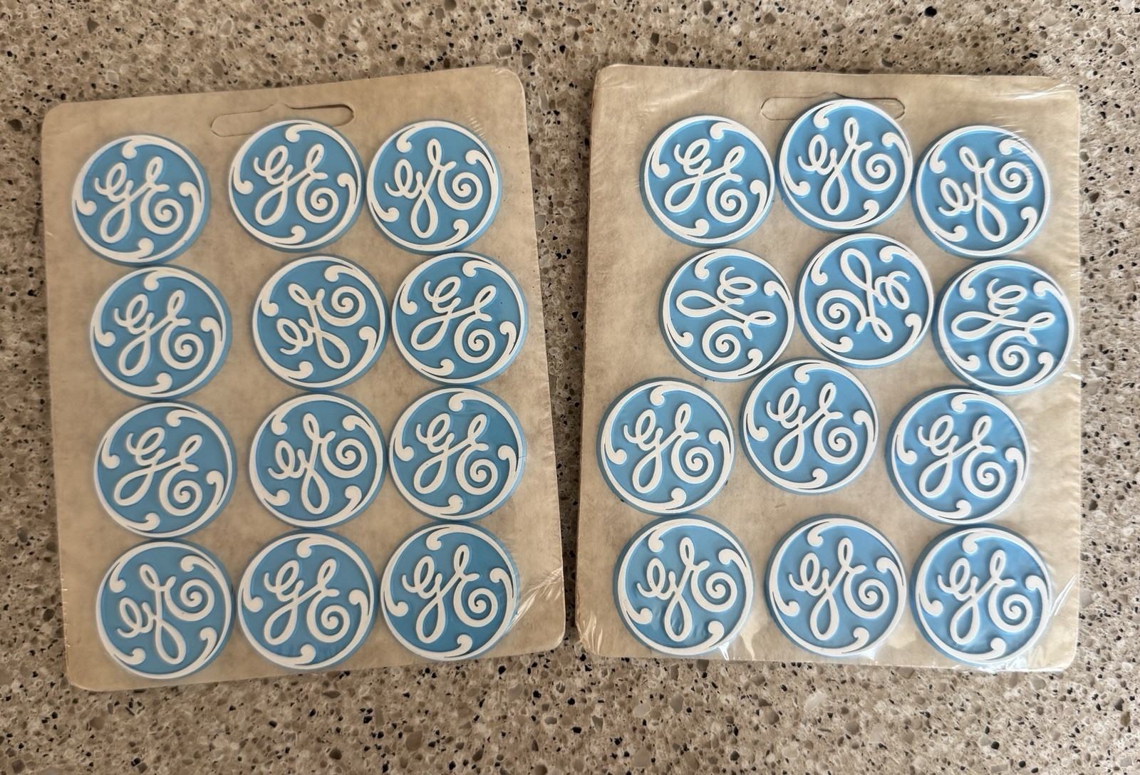 Vintage GE Blue & White Logo Advertising Magnets - new in plastic Vintage GE Blue & White Logo Advertising Magnets - new in plastic