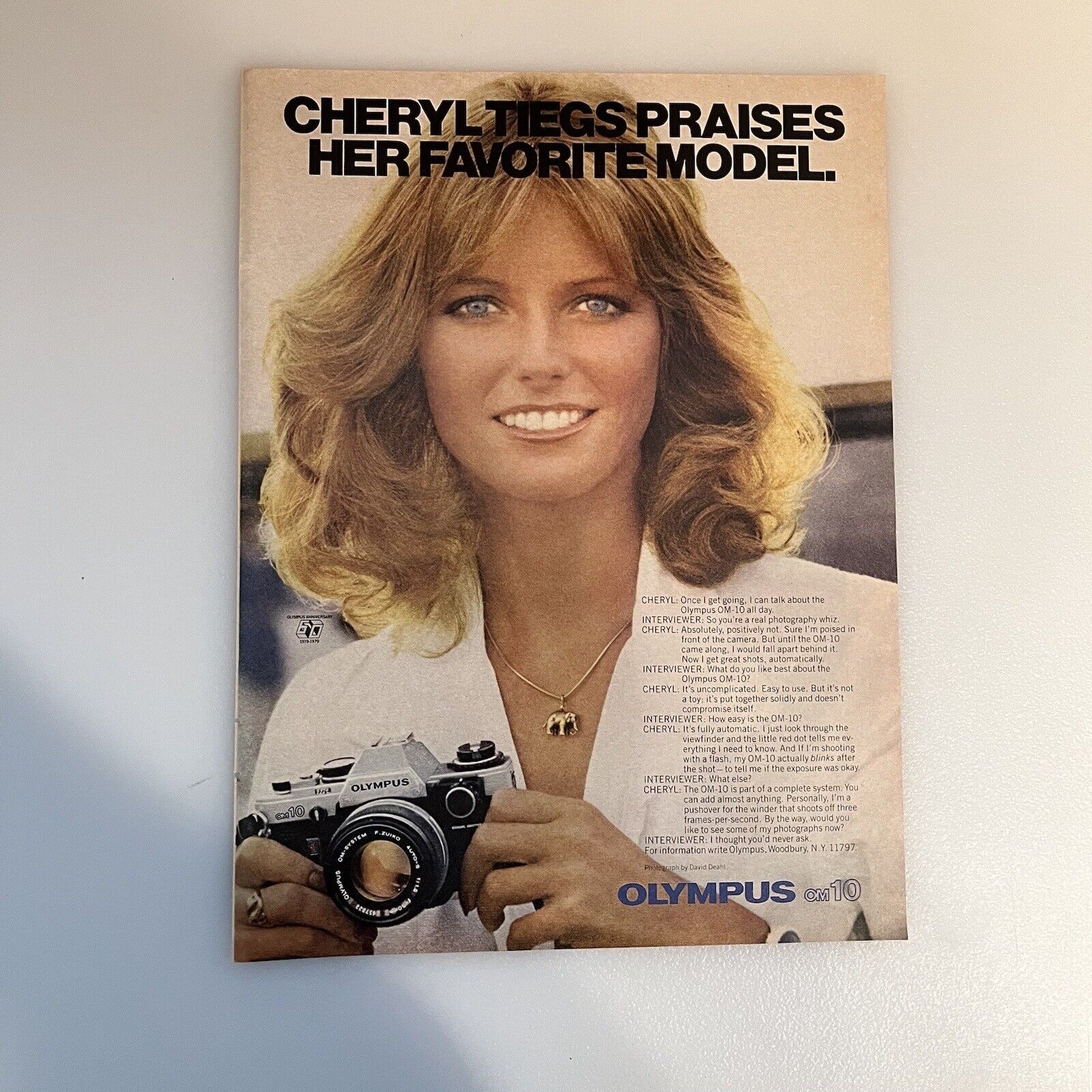 1980 Olympus OM-10 Camera Cheryl Tiegs Blond Model Print Ad Original Vintage