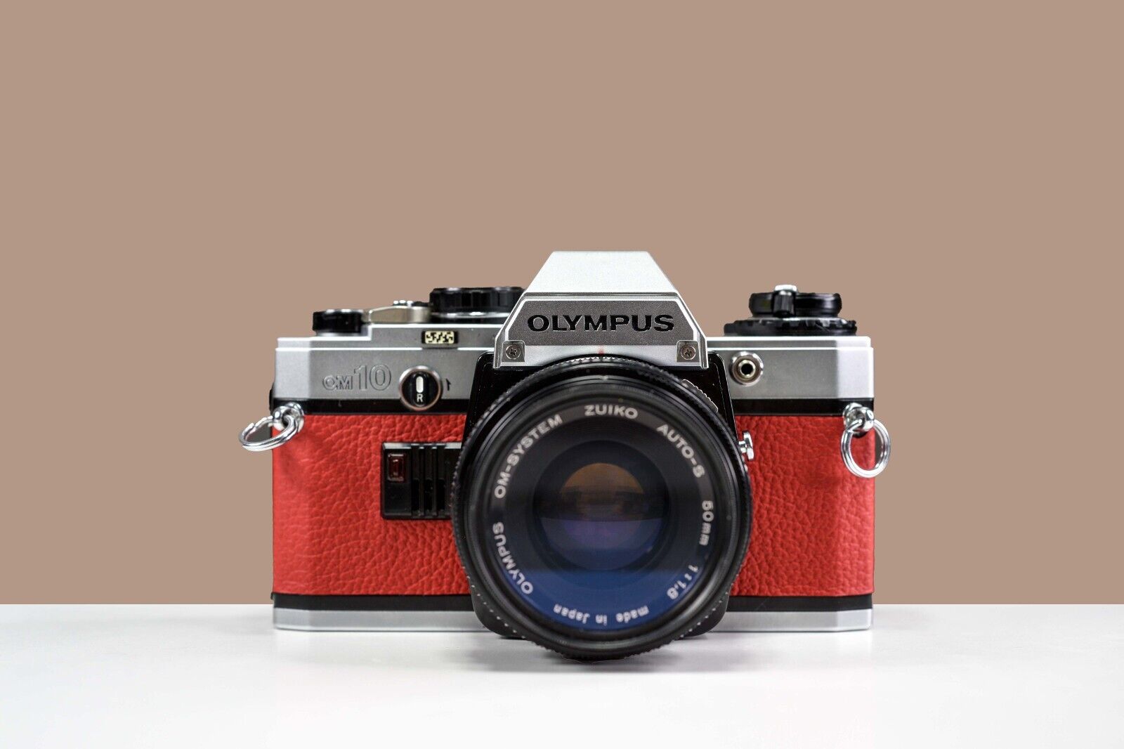 OLYMPUS OM10 35mm Film Camera w/ 50mm f/1.8 Zuiko Lens Red Leather | Serviced