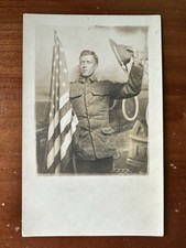 Great Shot, WWI soldier Waving Cap And Holding US flag postcard RPPC picture