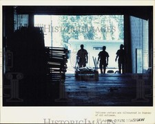 1988 Press Photo Coliseum workers silhouetted in Independence Arena - lra68011 picture