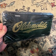 Vintage Oldsmobile Booster License Plate Sealed picture