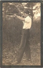 RPPC Teenaged Boy Shooting Toy Rifle or Shotgun early 1900s picture