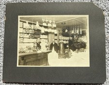 Vintage antique mounted Photograph clothing store interior & creepy doll picture