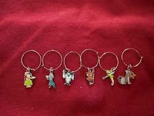 6 Retro Disney Wine Charms Featuring Disneyland Park Icons picture